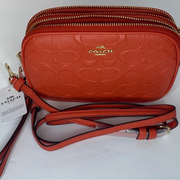 Coach camera bag with signature coated canvas detail. Shoulder/wrist strap.Coral - Picture 5 of 8